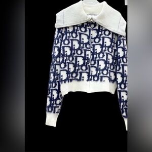 front zipper sweater stretchable material fits small two large.